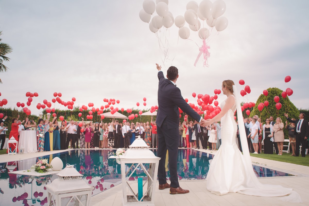 Destination wedding ceremony with mountain and water backdrop