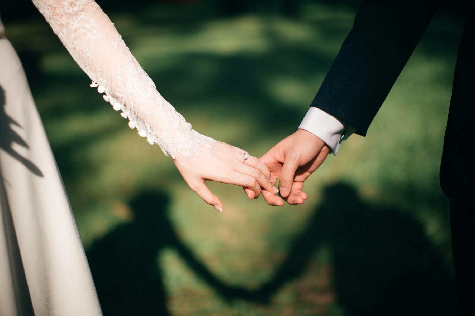 Couple exchanging vows during a cinematic ceremony broadcast